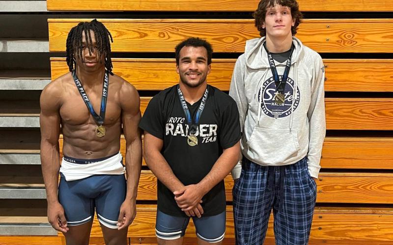 Mat Devils (L-R) Isaiah Davis, Jamaze Hall and Carter Fleming finished in first place in their weight classes during the Clash.