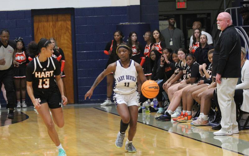 Lady Devil Terrace Hester takes the ball down the court during Elbert’s 68-44 win over Hart County in the Inferno Friday, Dec. 2. (Photo by Wells)