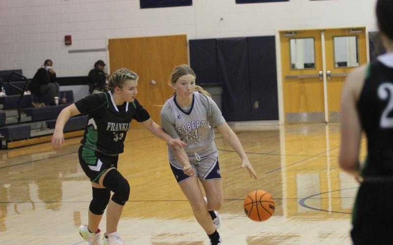 Eighth grader Audrey Lunsford takes the ball down the court during the Lady Rams’ win over Franklin County Monday. (Photo by Wells)