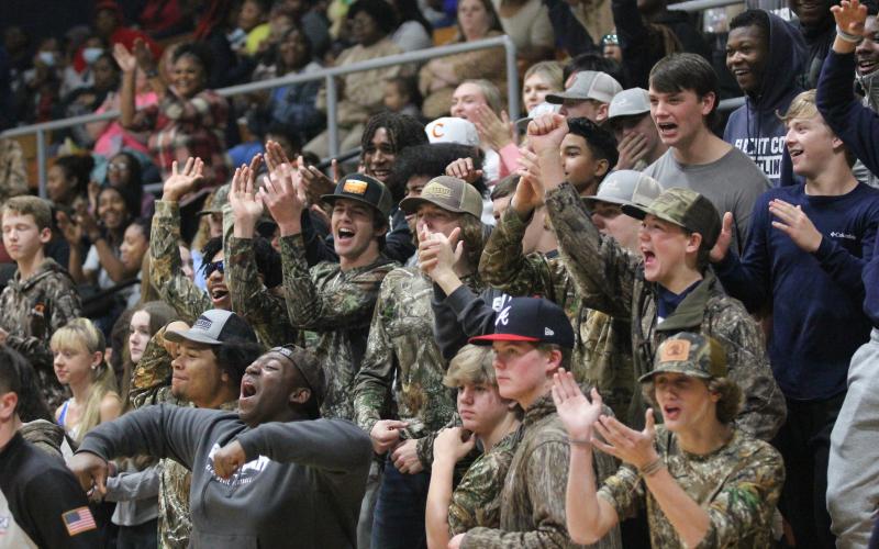 The Elbert County Comprehensive High School student section reacts to Moss’ dunk. (Photo by Wells)