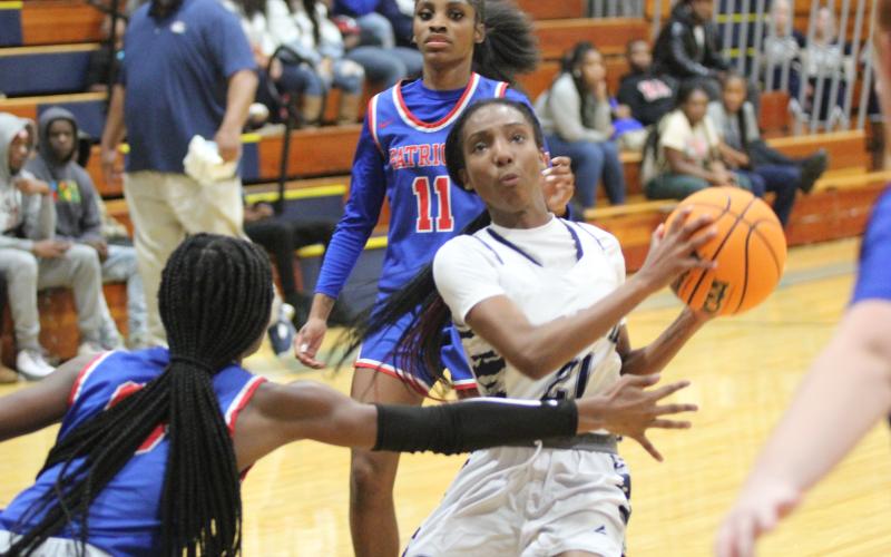 Senior Niya Moon scored 18 points and had 10 rebounds during the Lady Devils’ 73-54 win over Top 10 ranked Oglethorpe County Dec. 17. The win marked a seven-game winning streak for the Lady Devils. (Photo by Wells)