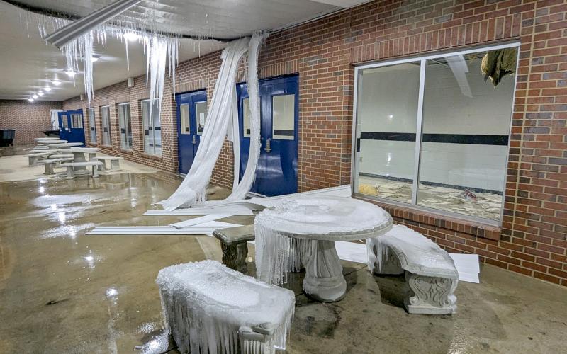 Left, pipes burst at Elbert County Middle School around Christmas Day, flooding 95 percent of the school and causing damage to other areas, including the inside and outside ceilings of the hall near the gym. (Photo by Scoggins)