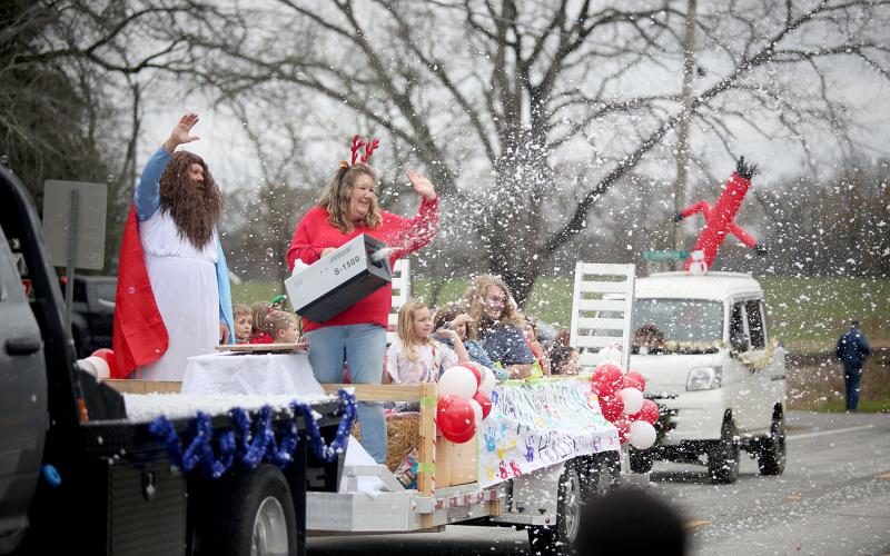 A float from Holly Springs Baptist Church brought ‘snow’ to the Bowman Christmas parade through the use of a snow machine Saturday, Dec. 10. See more photos from the festive parade on page 16. (Photo by Scoggins)