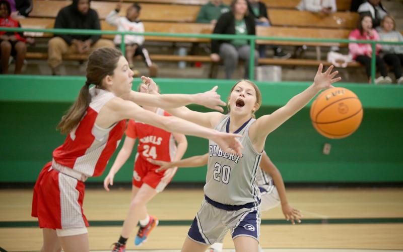 Seventh grade Lady Ram Brylee Dickerson attempts to distract a Stephens County seventh grade Lady Devil during Elbert’s 29-9 smackdown in the first round of the NEGIAA basketball tournament at Franklin County High School Jan. 14. (Photo by Scoggins)