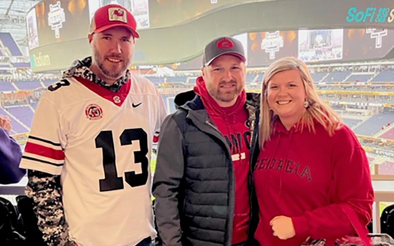 Pictured at the National Championship game inside SoFi Stadium in Inglewood, California are (L-R) Chase Tiller, Chris Morris and Sommer Morris