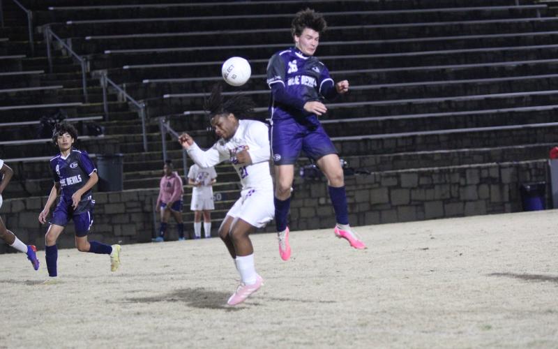 Junior Brandon Horne scored three goals during the Devils’ 8-4 win over Athens Christian Feb. 14 in the Granite Bowl. (Photo by Wells)