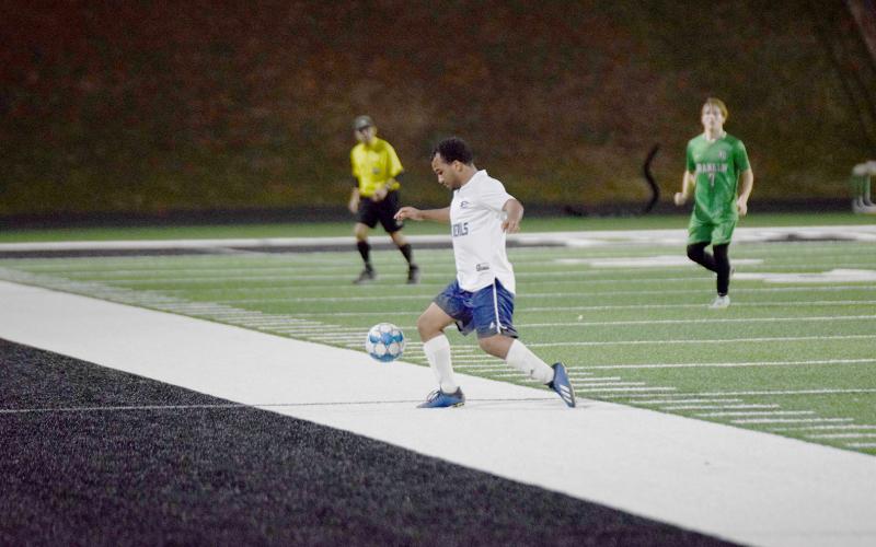 Blue Devil Jamaze Hall works the ball around a Franklin County defender in Carnesville Feb. 21. (Photo by Shane Scoggins, Franklin County Citizen Leader)
