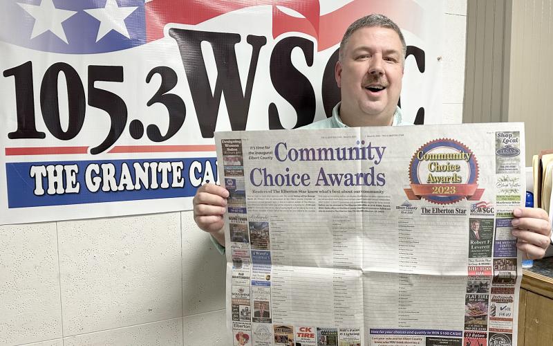 WSGC Radio station owner and operator Stan Brown encourages citizens to vote in the Community Choice Awards. (Photo by Scoggins)
