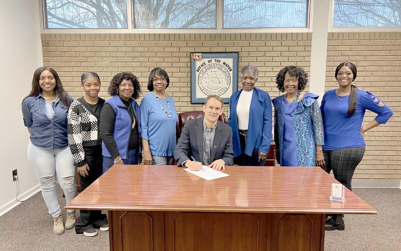 Pictured during the proclamation signing are (L-R) Sherell Eberhardt, Tiyah Turman, Edna Eberhardt, Margie Hunter, Graves, Pamela Allen, Lenora Dubose and Tiara Eberhardt.