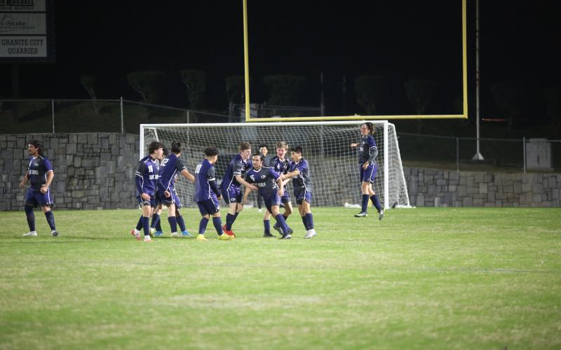 A host of Blue Devils celebrate with Juan Martinez after he scored a goal against Tallulah Falls Thursday, March 9 in the Granite Bowl.