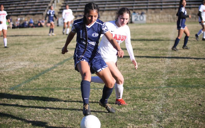 Vivian Salazar covers the ball from a Rabun County defender during the Lady Devils’ region matchup March 14.