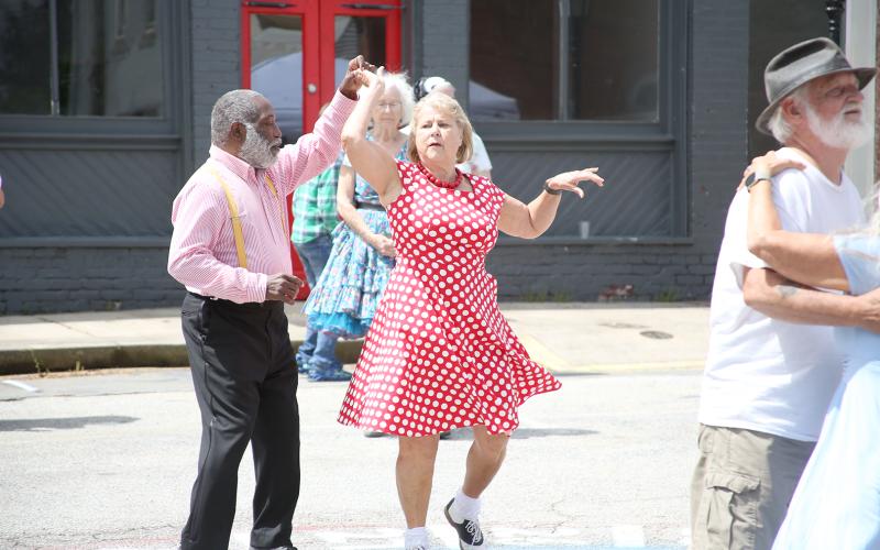 Members of the Happy Feet Dance Club including (L-R) Robert Davenport, Patsy Suttles, Carolyn Clarke and Richard Peek enjoyed dancing to the music of the County Line Jazz Ensemble at the Bowman Spring Festival Saturday, April 22. For more photos, see page 4A. (Photos by Scoggins)