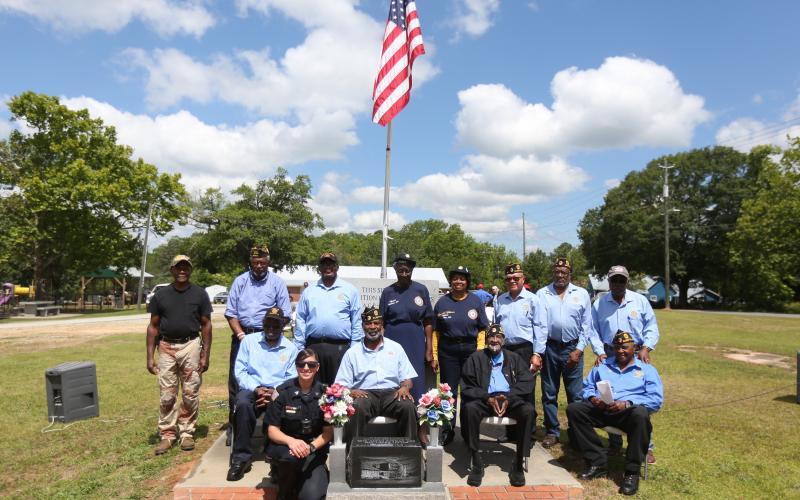 Pictured following the program are (first row) Sgt. Virginia Shelton; (second row, L-R) Charles Brawner, Frederick Walton, James Zanders and Ralph Hughes; (third row, L-R) Sam Hill, Daniel White, James Syphore, auxiliary Chaplain Della Wheeler, auxiliary member Henrietta Taggart Williams, Terry Burton, Robert Barnett and John M. Clark. (Photo by Scoggins)