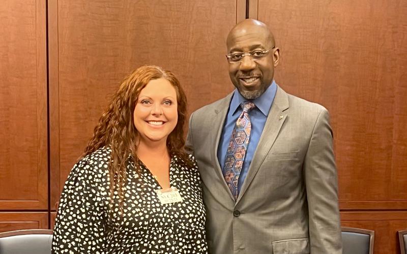 The Medical Center of Elberton’s Practice Administrator Brooke McDowell poses with Georgia Senator Raphael Warnock after their “Coffee with a Senator” meeting in the United States Capitol building June 22. (Photo by Hall)