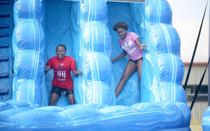 The water slide brought out all smiles at McWilliams Park June 17 during the Friends Helping Friends’ second annual Football Fun Day with Mecole Hardman Jr. The event included the water slides, a mini football combine, food vendors and more. See more photos and information from the event, along with the annual Friends Helping Friends Bekkah FHF VBS Camp at Rock Branch Baptist Church on page 6. (Photo by Wells)