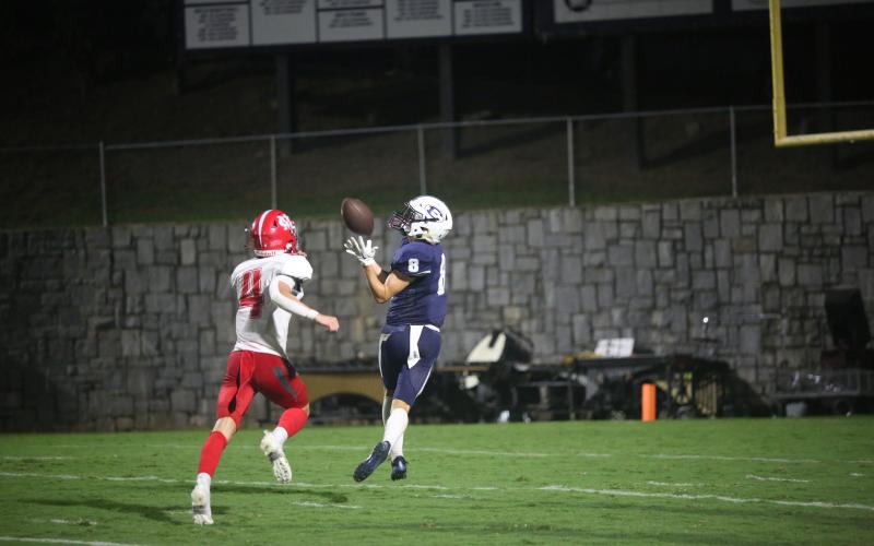 Eli Harris catches a 40-yard touchdown pass in Elbert County’s 55-35 loss to Madison County Aug. 25. Harris finished with four catches for 65 yards and a touchdown in the loss. (Photo by Wells)