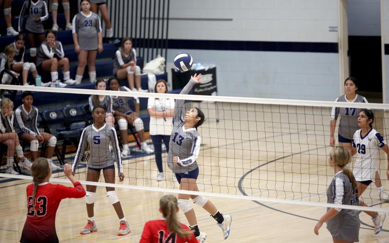 Sophia Vargas leaps as she spikes the ball in Elbert County Middle School’s 2-0 win over Rabun County Aug. 28. (Photo by Wells)