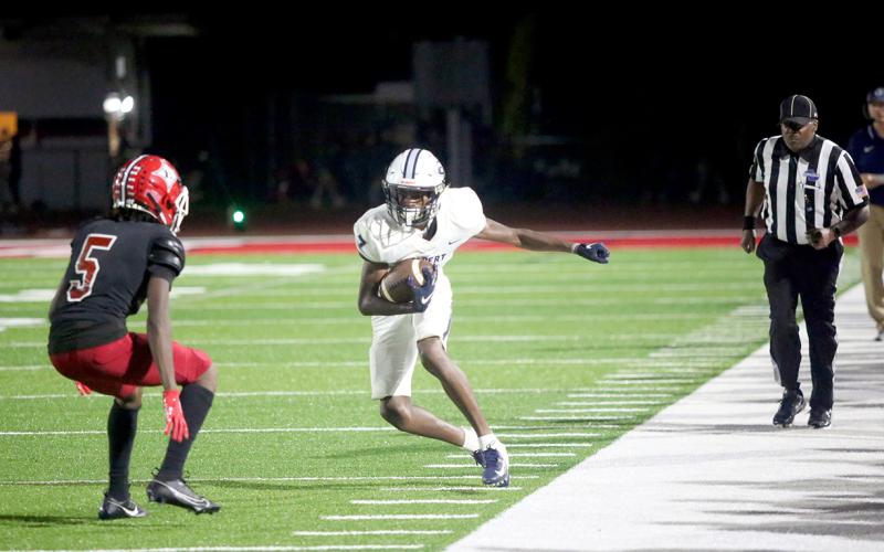 D.K. Winn tightropes down the sideline on one of his eight receptions. Winn finished with eight catches for 101-yards recieving. (Photo by Wells)