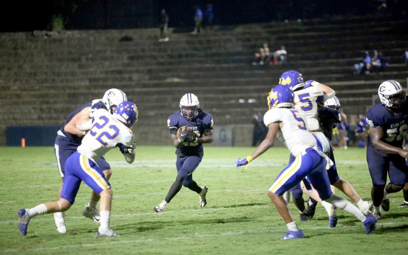 Jacari Barnett looks up-field as he carries the ball during Elbert County’s 36-27 comeback win over Washington-Wilkes in the Granite Bowl Sept. 15. Barnett led the team with 160-yards rushing and three touchdowns in the win as the Devils improved to 4-1 on the season. (Photo by Wells)