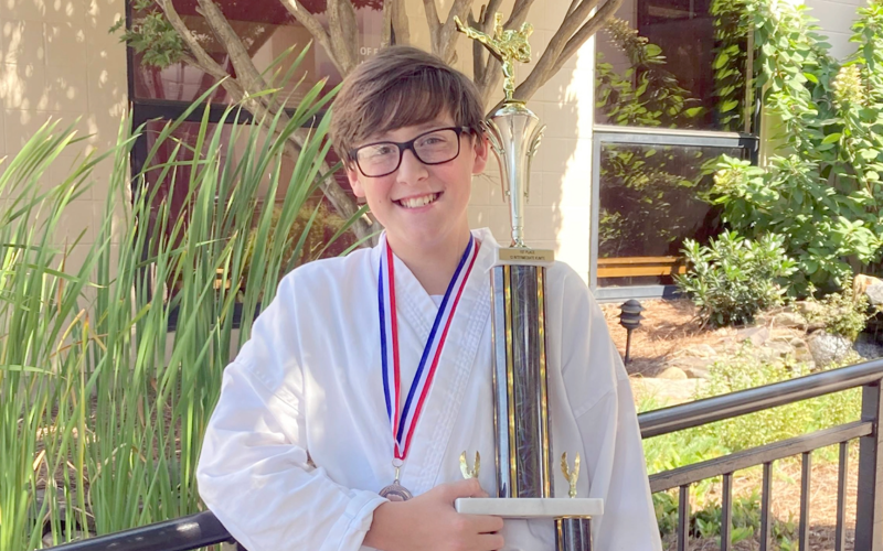CJ’s Karate student Jase Bell took home the trophy for winning the fighting division at Kyu Fest in Charlotte, North Carolina for the second year in a row. Bell is the son of Robbie and Kathy Bell.