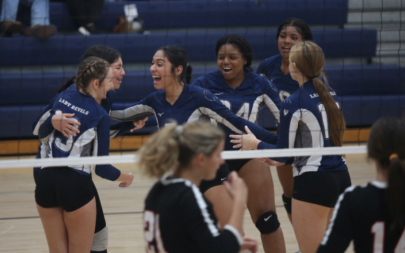 The Volley Devils celebrate after scoring a point against Rabun Couinty Sept. 28. The Lady Devils are set to face Barrow Arts and Sciences Academy in the area tournament Oct. 4. (Photo by Wells)