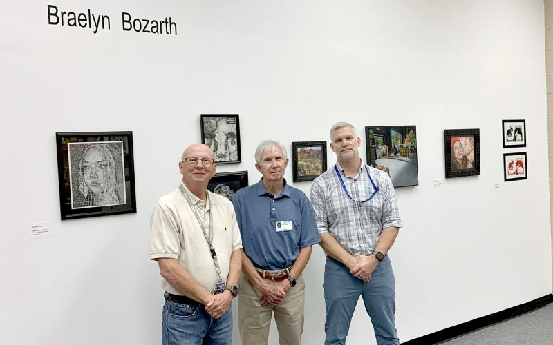 Elbert County Comprehensive High School recently unveiled the Bennett-Jossey Art Gallery in the school library as a place to display student work. Pictured are the gallery's namesakes and longtime art teachers (L-R) David Bennett and Joe Jossey and current art teacher Lee Wells.
