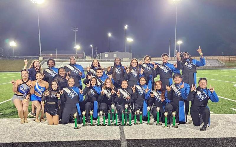 The Elbert County Blue Devil Band leadership team poses with a collection of trophies won at the Pridelands Marching Competition in Franklin County Sept. 30. (Photo submitted by Ansley McNeese)