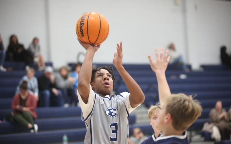 Elijah Gaines floats a shot over a Habersham defender during  the game against Habersham. (Photo by Wells)