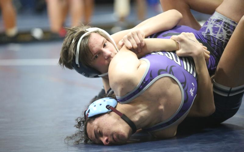 Hudson Fleming traps his opponent’s arm on his way to a pin during Elbert’s 77-6 dual win over Duluth Dec. 9. (Photo by Wells)