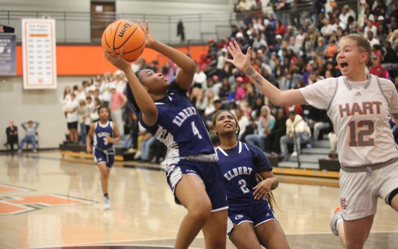 No. 4 Kaylen Rucker leans away from a Hart County defender as she gets a shot up in Elbert’s loss to Hart County. (Photo by Wells)