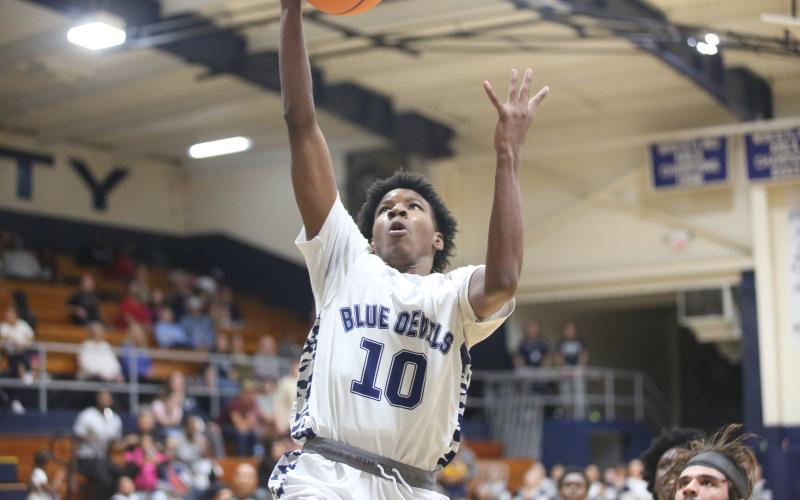 A.J. Brown punctuates an Elbert fast break with a slam dunk. (Photos by Wells)
