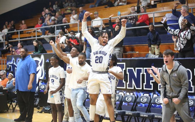 The Elbert bench reacts to a slam dunk by A.J. Brown. (Photo by Wells)