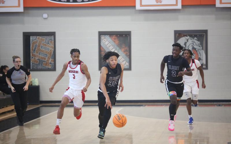 Landon Hill drives down the floor. (Photo by Wells)