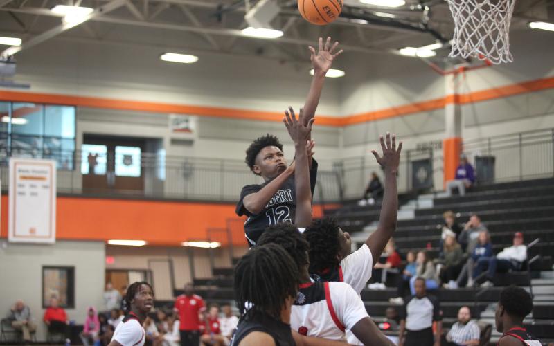 D.K. Winn floats a ball over the Social Cirlce defense. (Photo by Wells)