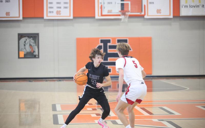 Grady Jones tries a crossover move on a Social Circle defender. (Photo by Wells)