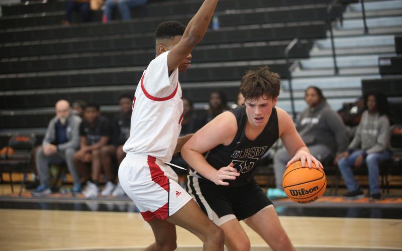 Haven Adams dribbles the ball in the post. (Photo by Wells)