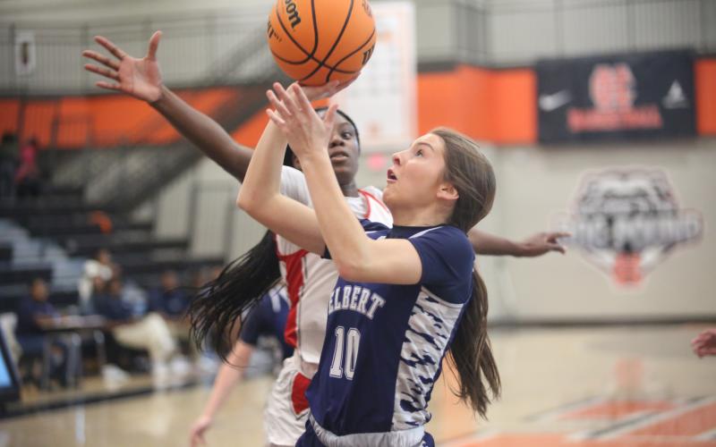 Hannah Brady puts up a layup while a Wade Hampoton defender attemps a block. (Photo by Wells)