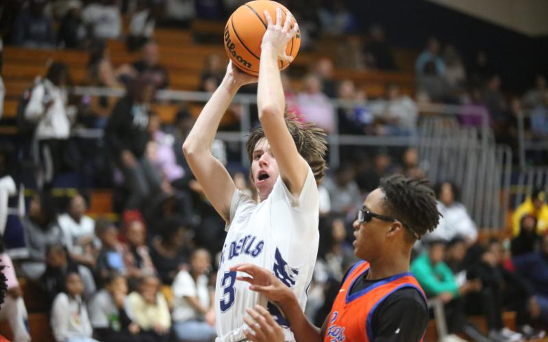 Grady Jones goes up with the ball as he tries to lay the ball into the basket during Elbert’s loss to Cedar Shoals. (Photo by Wells)