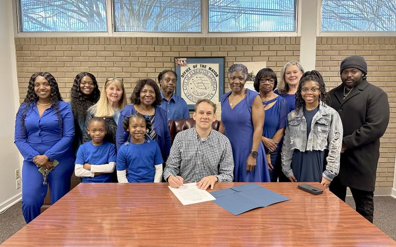 Pictured during the proclamation signing Saturday, Feb. 24 at Elberton City Hall are (L-R) Sherell Eberhardt, Tiara Eberhardt, Susie Payne, Xavier Strong, Layla Strong, Edna Eberhardt, Tyrene Turman, Mayor Daniel Graves, Pam Allen, Ruth Hunter, Heather Dent, Tiyah Turman and Terrence Eberhardt. (Photo courtesy of the City of Elberton)