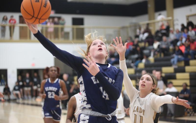 Audrey Lunsford gets by a Commerce defender and lays in an acrobatic layup during the Lady Devils loss to Commerce Feb. 2. (Photo by Wells)