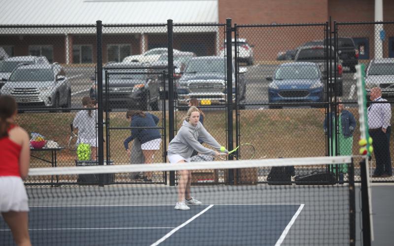 Breanna Pulliam leans for a shot during the Feb. 8 match against Clarke Central. (Photo by Wells)