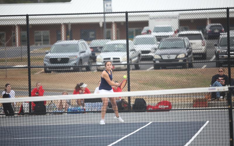 Emily Poon returns a volley during the match against Clarke. (Photo by Wells)