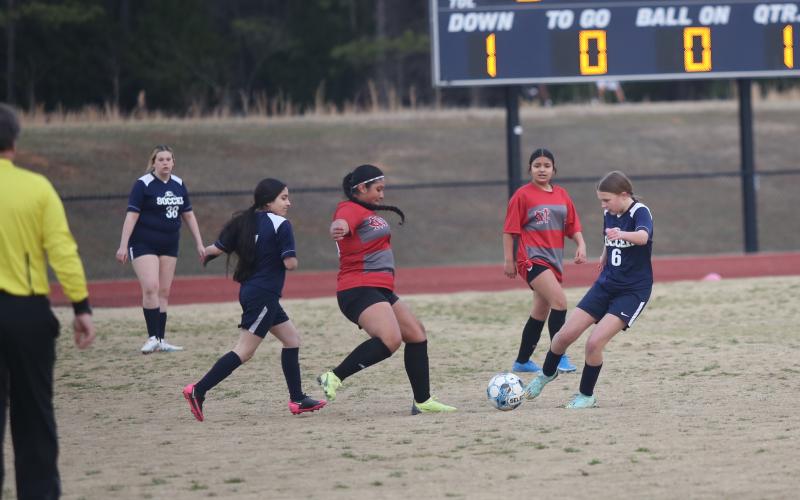 Bella Powell beats a Madison defender to the ball during Elbert’s game against the Mustangs Feb. 8. (Photo by Wells)