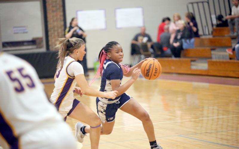 Kaylen Rucker pushes past an Athens Christian defender during Elbert’s loss to Athens Christian in the Region 8A Division tournament. (Photo by Wells)