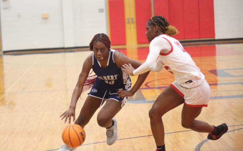Zy Belcher drives to the basket during Elbert County’s win over Oglethorpe Feb. 21. (Photo by Wells)