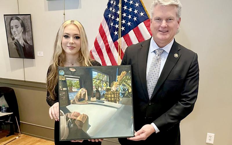 Elbert County Comprehensive High School senior Braelyn Bozarth (left) won the 2024 Congressional Art Competition hosted by Rep. Mike Collins (right).