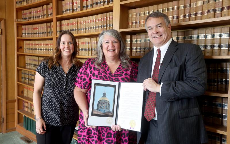 The Elbert County Chamber of Commerce's centennial anniversary was celebrated at all levels over the past week as the City of Elberton, Elbert County Board of Commissioners and State House Rep. Rob Leverett honored the Chamber with resolutions and proclamations. Pictured are (L-R) Long, Fortson and Leverett. (Photo by Scoggins)