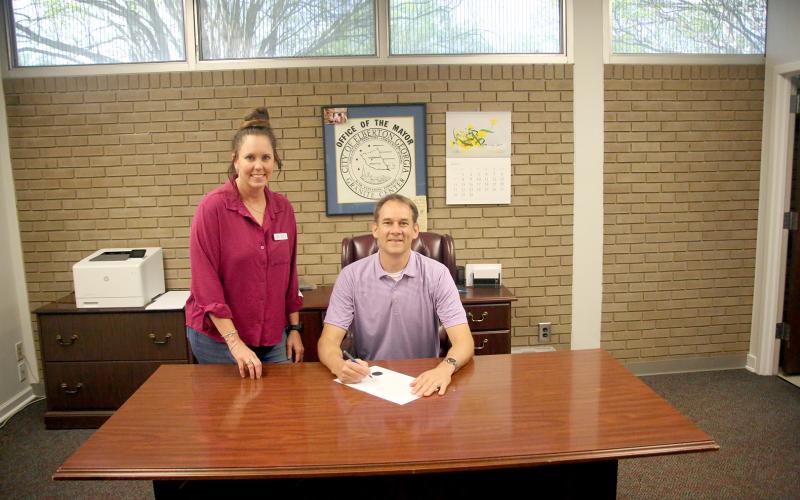 The Elbert County Chamber of Commerce's centennial anniversary was celebrated at all levels over the past week as the City of Elberton, Elbert County Board of Commissioners and State House Rep. Rob Leverett honored the Chamber with resolutions and proclamations. Pictured are (L-R) Long and Mayor Daniel Graves. (Photo by Wells)