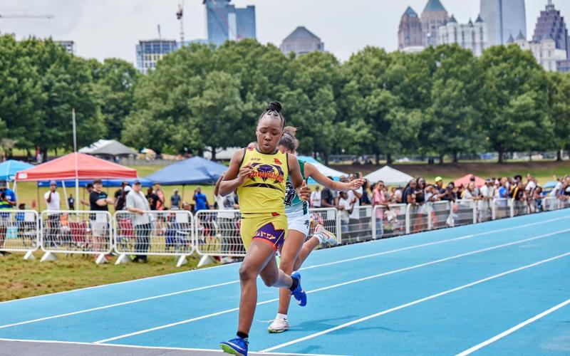 Makenzie Cade beats another runner to the finish line at the ATL City Games. (Photo submitted by Joshua Bolton)
