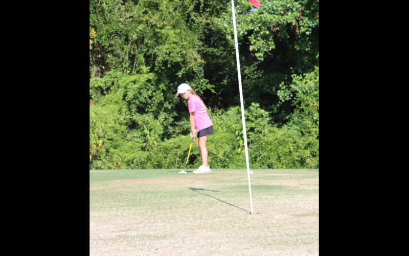McKenzie Kesler lines up a putt at the Elberton Country Club. (Photo by Weeks)